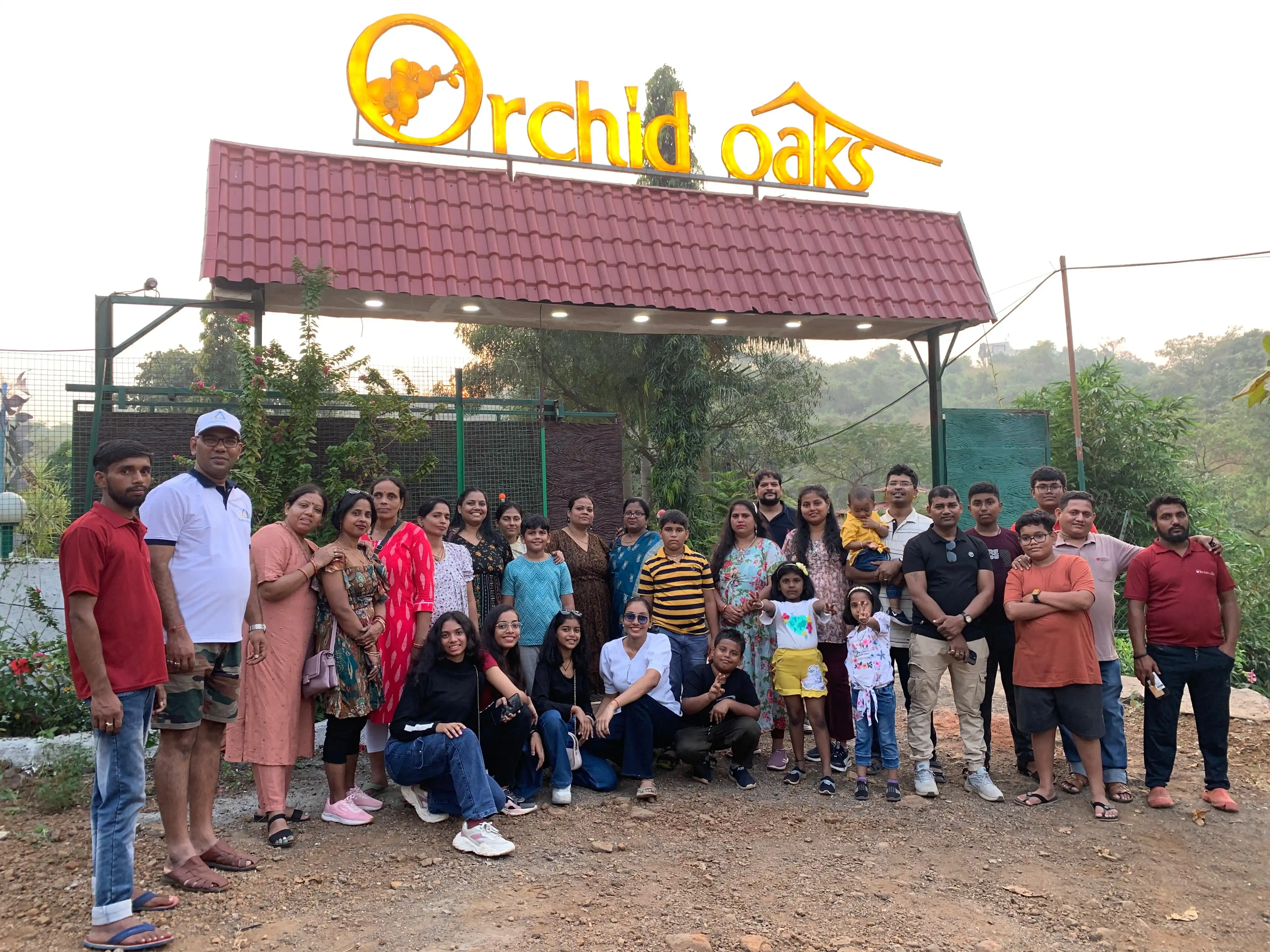 Family At Gate Of Orchidoaks at Orchid Oaks Homestead Panvel