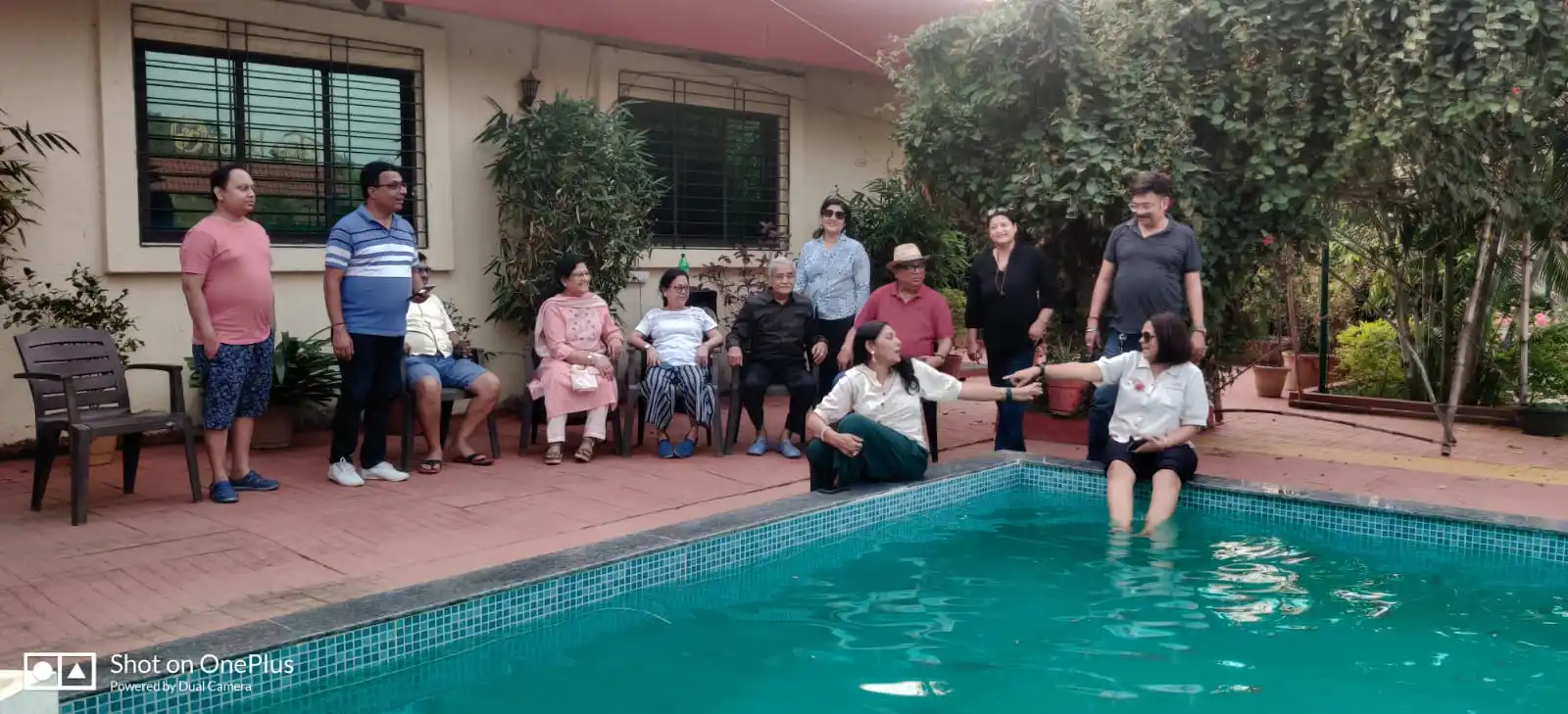 Family At Swimming Pool at Orchid Oaks Homestead Panvel